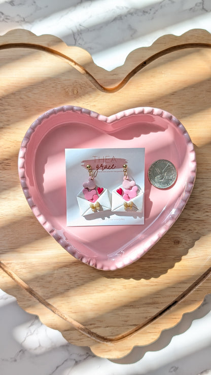 DEAR M. LETTER DANGLES