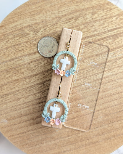 FRAMED CROSS DANGLES