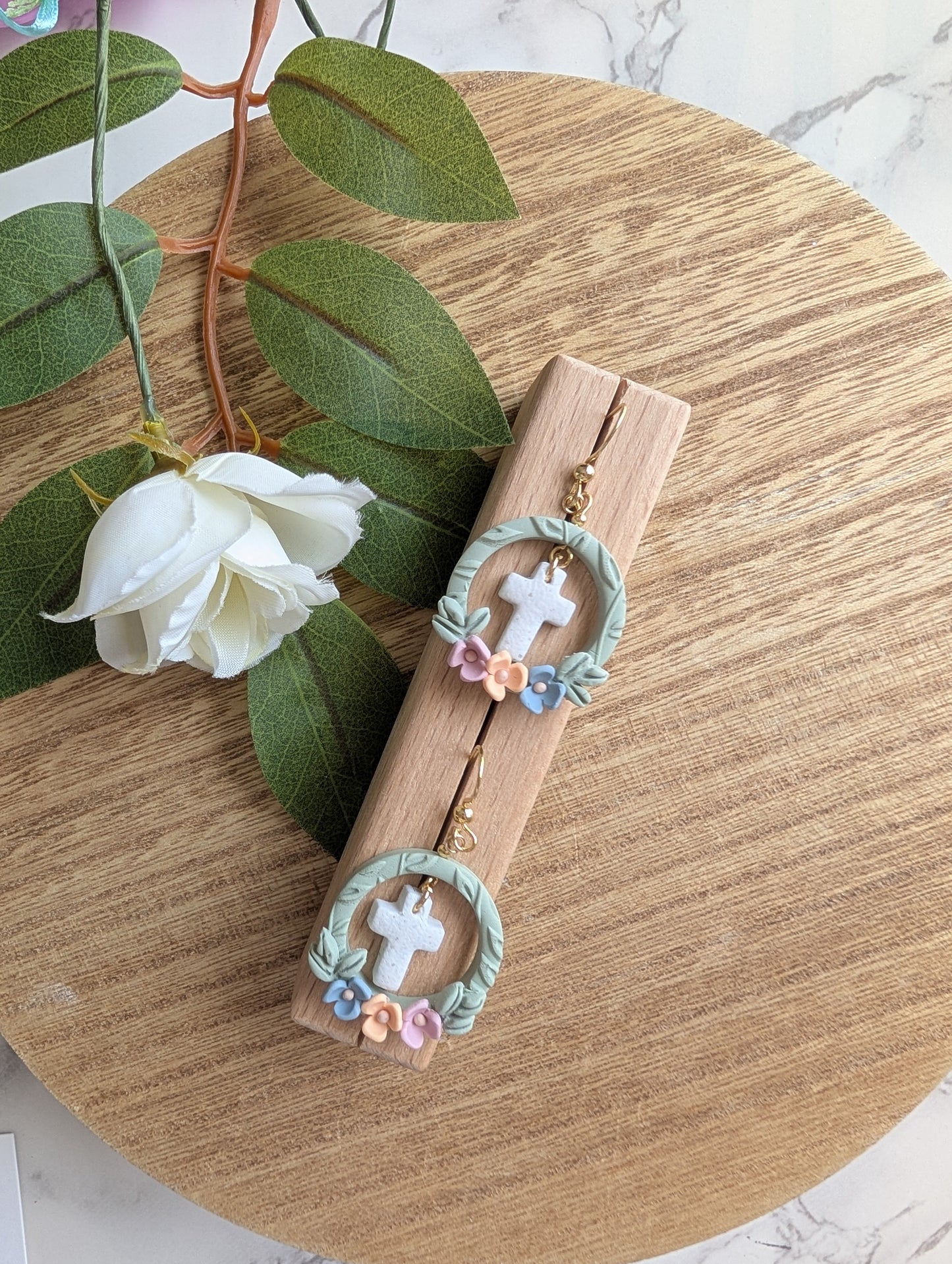 FRAMED CROSS DANGLES